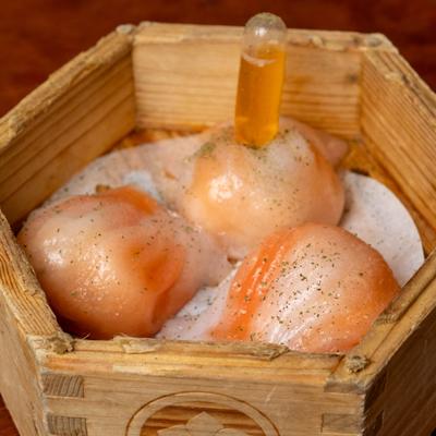 Lobster dumplings with butter sauce.