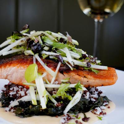 Grilled salmon, with braised greens and herb salad.