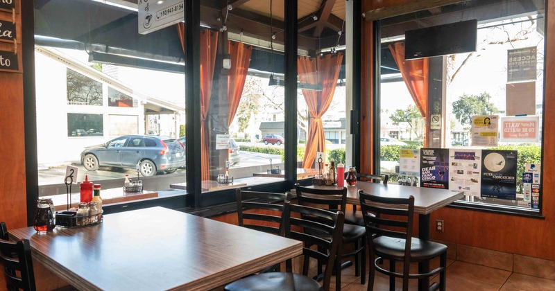 Interior, dining tables by windows
