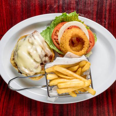 Bacon Cheeseburger topped with onion ring and served with fries in wire basket.