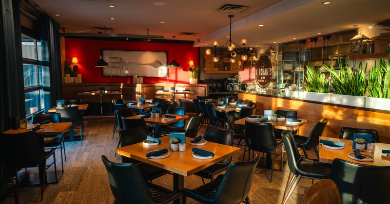 Interior, dining area, wooden top tables for four and two, ready for guests