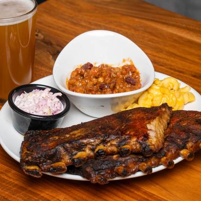 Smoked ribs, served with coleslaw, baked beans, and mac and cheese.