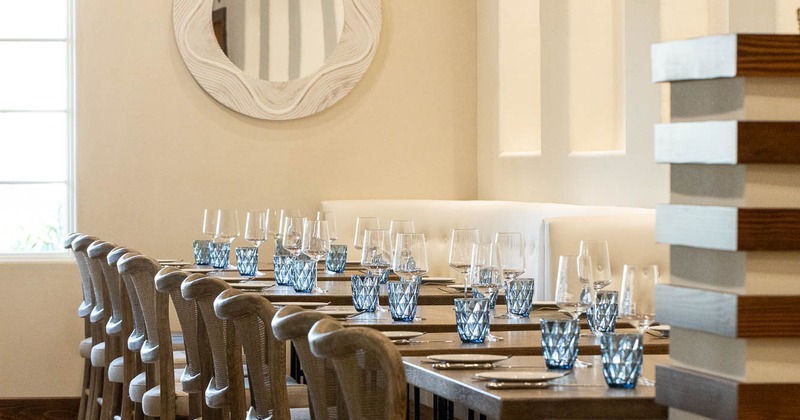 Interior, lined up tables ready for guests