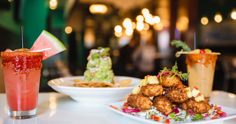 Several dishes served with cocktails