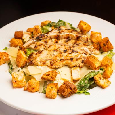 Caesar salad with grilled chicken and croutons