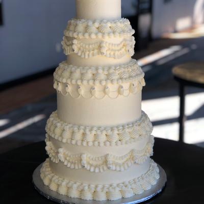 White wedding cake with ruffles