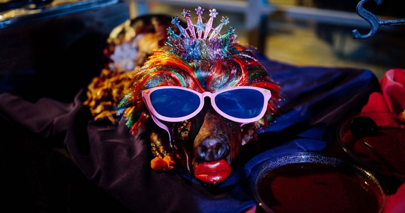 Roasted pig with wig and sunglasses