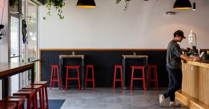 Interior, high tables and red chairs