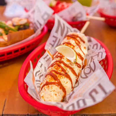 Grilled corn, dip on top