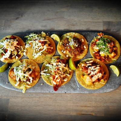 Assorted open-faced tacos.