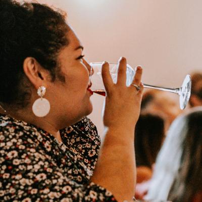 A person drinking wine.