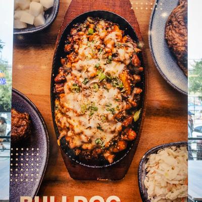 Interior, Bulldoc dish poster on the restaurant's window.