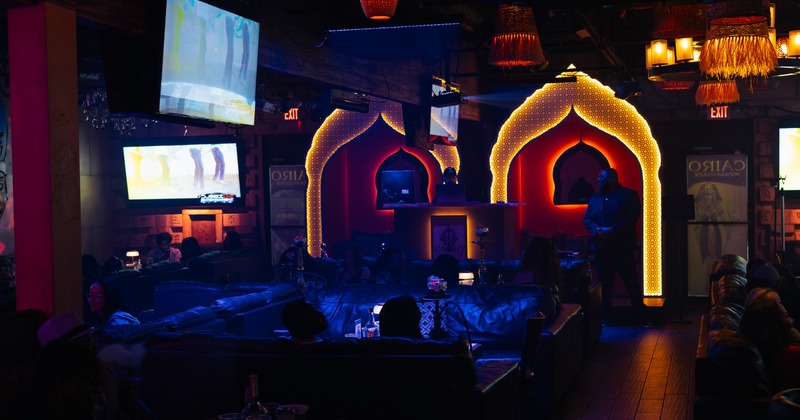 Interior, a comfortable place to sit, dimmed light, sofas, chandeliers, TV screens