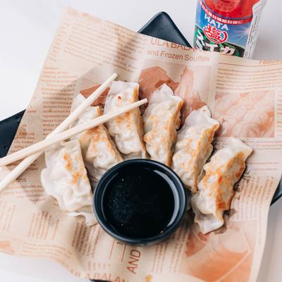 Fried dumplings, with dip.