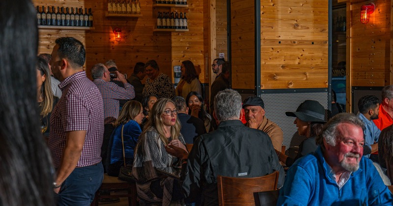 A restaurant scene featuring people at tables