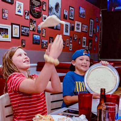 Two children playing with dough