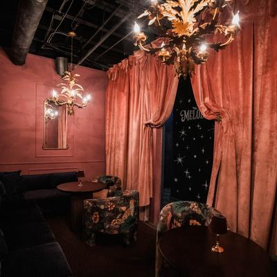 Tables, seats, and curtains.