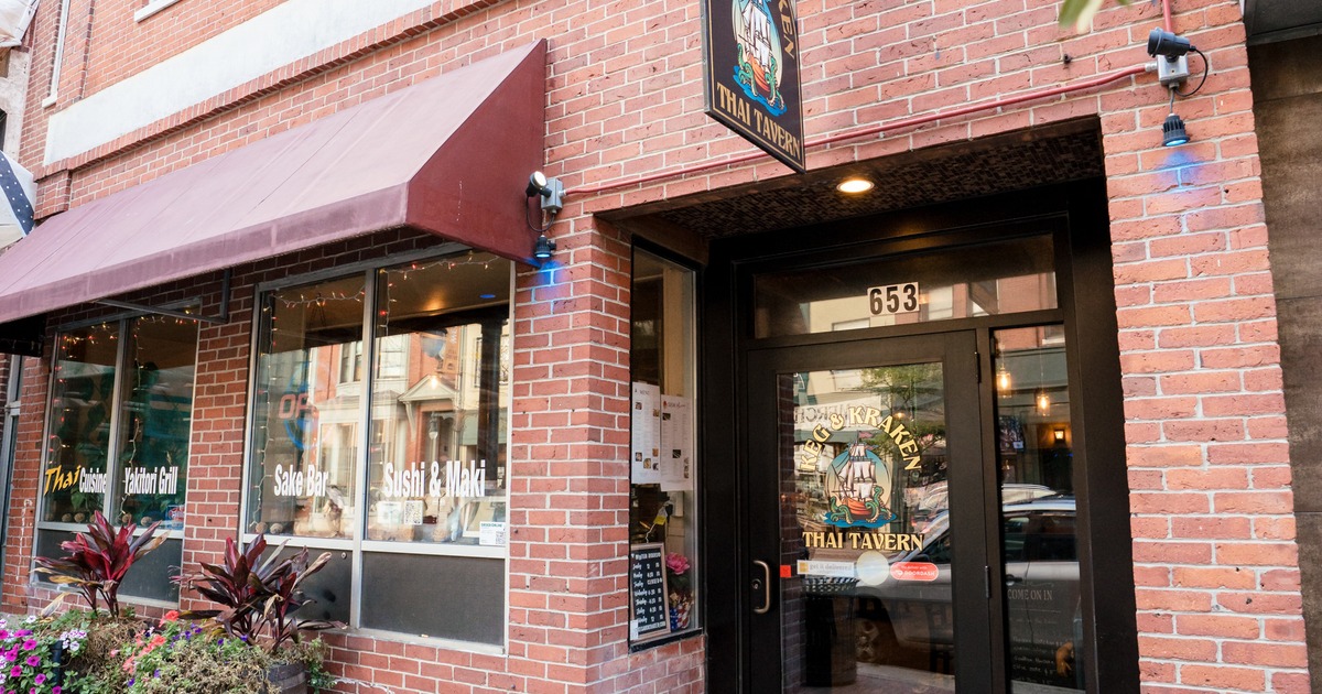 Exterior, angle view to front restaurant, entrance, sign above