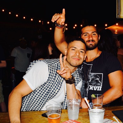 Two guests enjoying drinks, having fun.