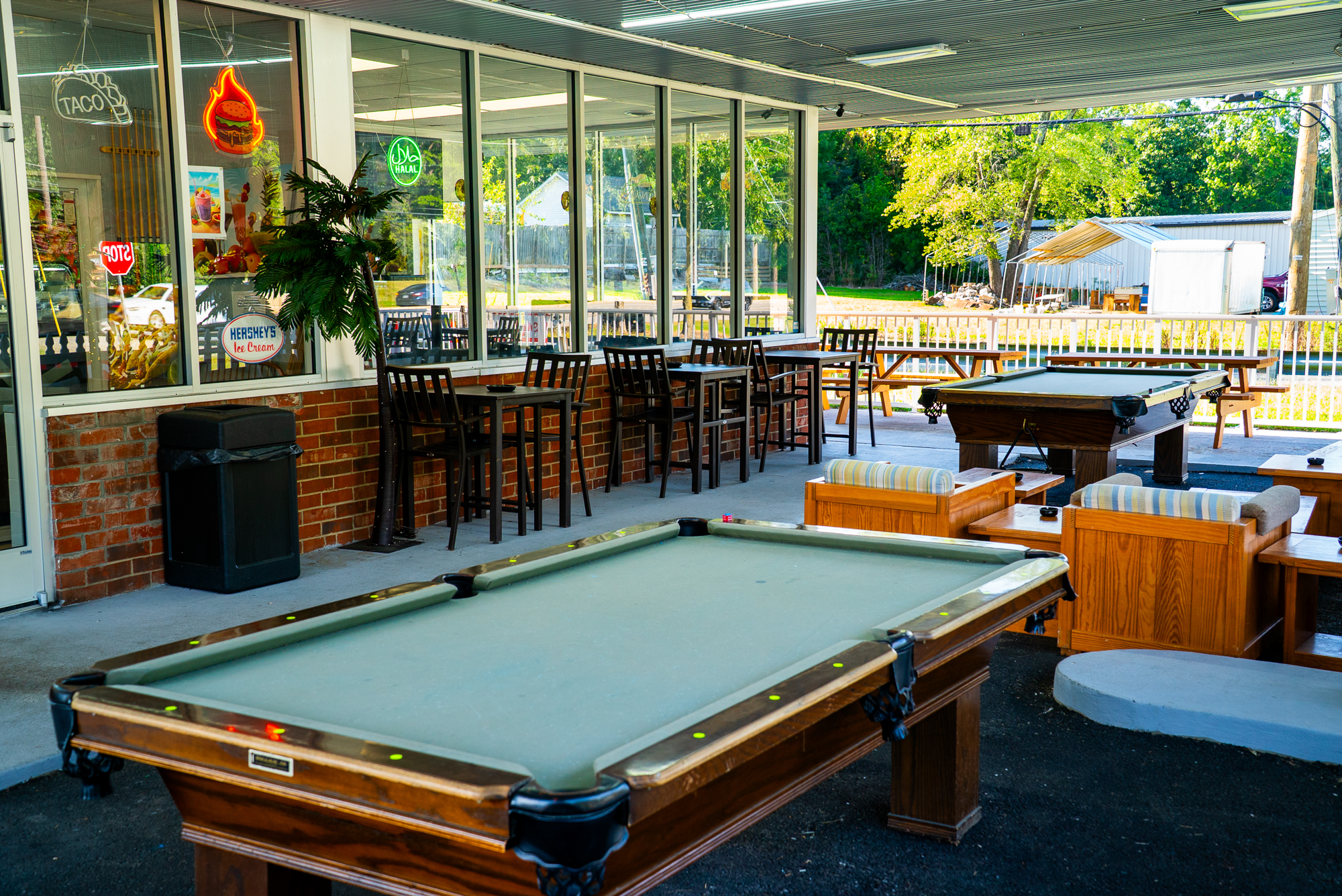 Exterior, patio, terrace, pool table, bar behind