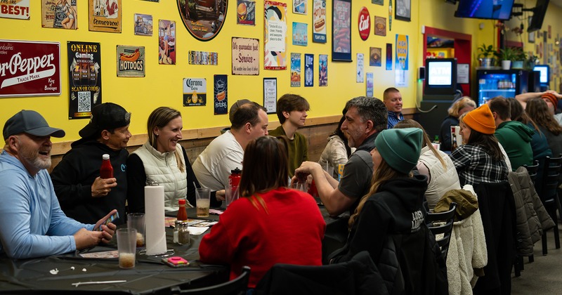 Interior, guests chatting and enjoying their drinks