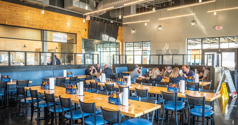 Interior, tables and blue cushion chairs line up