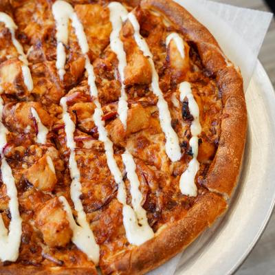 A close up of Chicken Bacon Ranch Pizza.