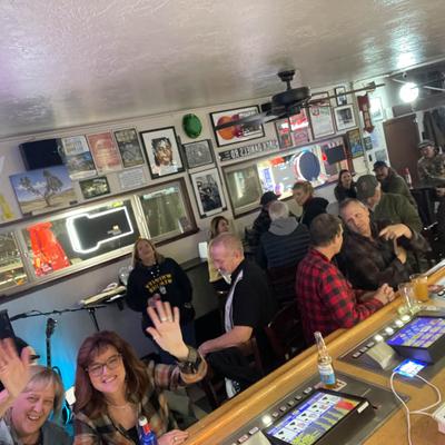 Interior, guests enjoying their time at the bar counter and tables.