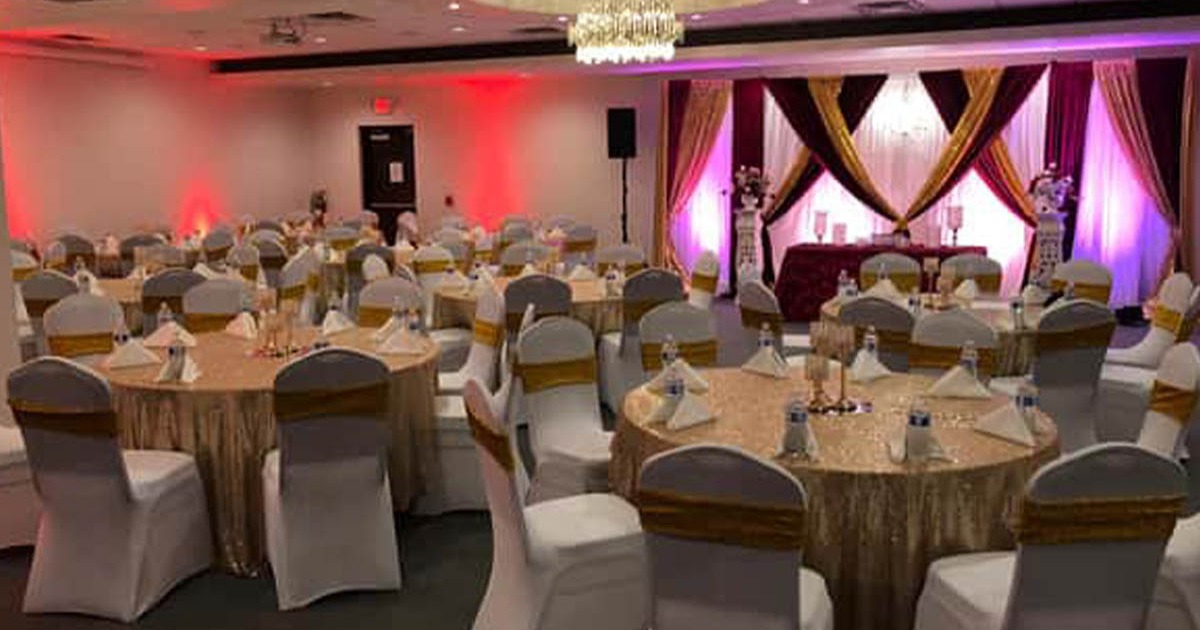 A decorated banquet or event hall set up for a special occasion such as a wedding or reception