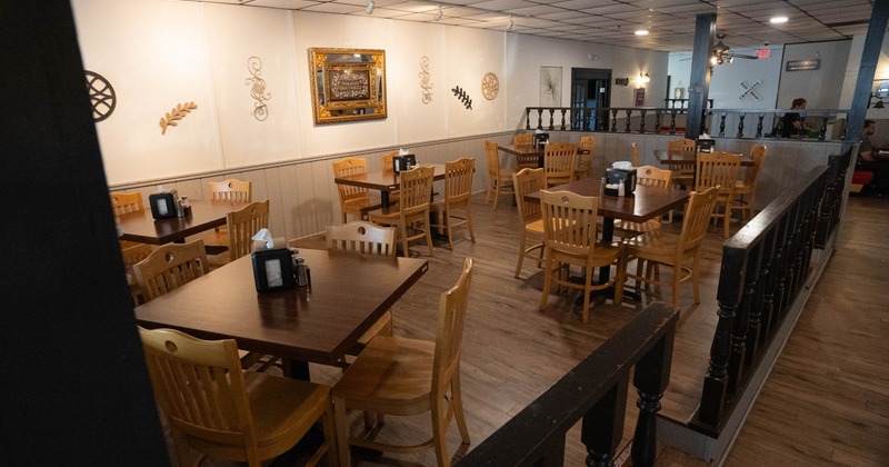 Interior of a cozy restaurant with wooden tables and chairs