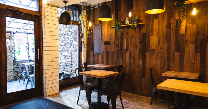 Entrance view, seating area, tables ready for guests