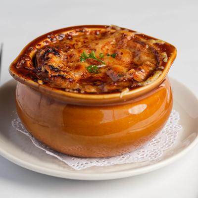 Served onion French soup in a dish.