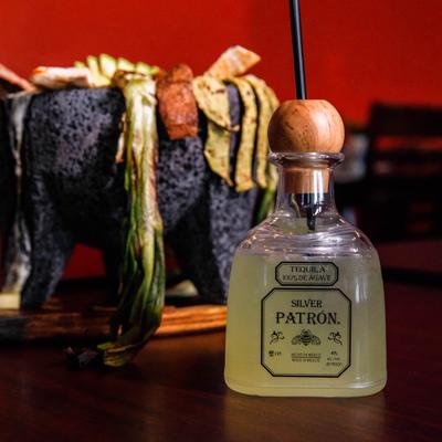Patron Margarita, served in a tequila bottle.