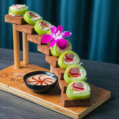 Fantastic 4, Cucumber Wrapped, served with hot sriracha sauce on the side.