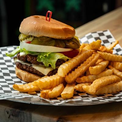 Double cheeseburger served with fries.