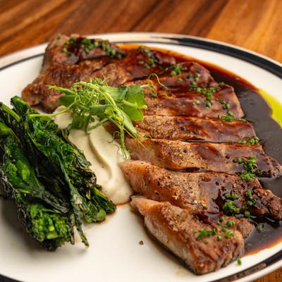 Wagyu Strip Steak with cauliflower puree and  broccoli rabe.