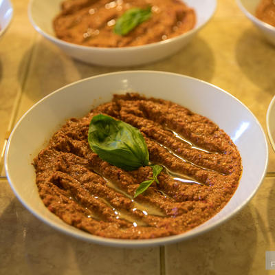 Red sauce with cucumbers closeup