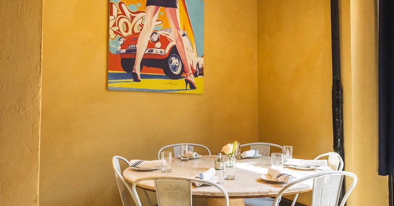 Interior, table in corner ready for guests