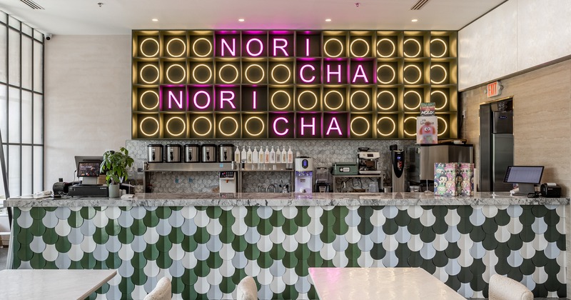 Interior, diner area, tables, chairs, food counter behind