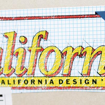 A close-up of a sketch of 'California Design' on grid paper
