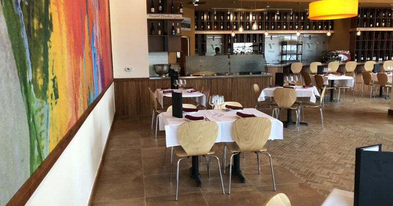 Interior, cozy dining area with set tables