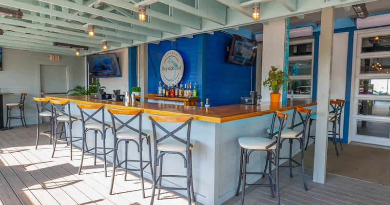 Outdoor bar seating area with bar stools