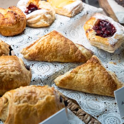 Turnovers displayed alongside other pastries, close view.