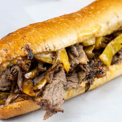 Philli cheesesteak sandwich with melted cheese.
