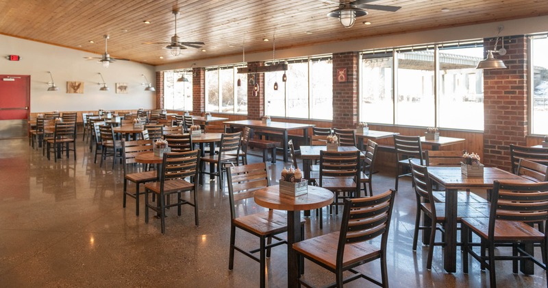 Interior, seating area, tables for two, four, and eight, tables with benches