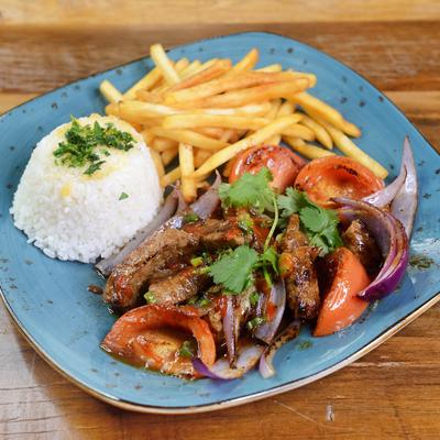 Beef stir fry served with white rice and fries.