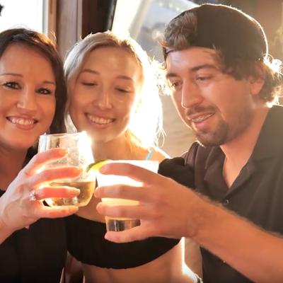 Customers toasting with drinks.