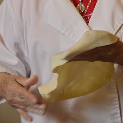 Unrecognizable person prepares tortilla