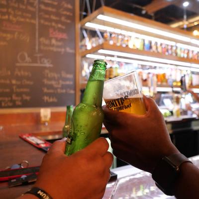 Guests toast with beer