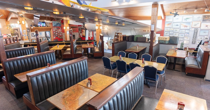 Diner area, wide view, tables and chairs, bar